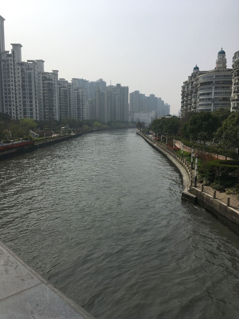 Large buildings along winding river